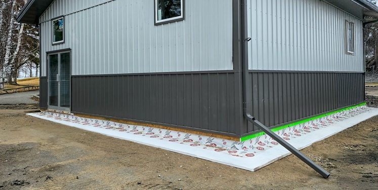 Frost Shield rigid insulation system with notched keyway for post-frame foundations.